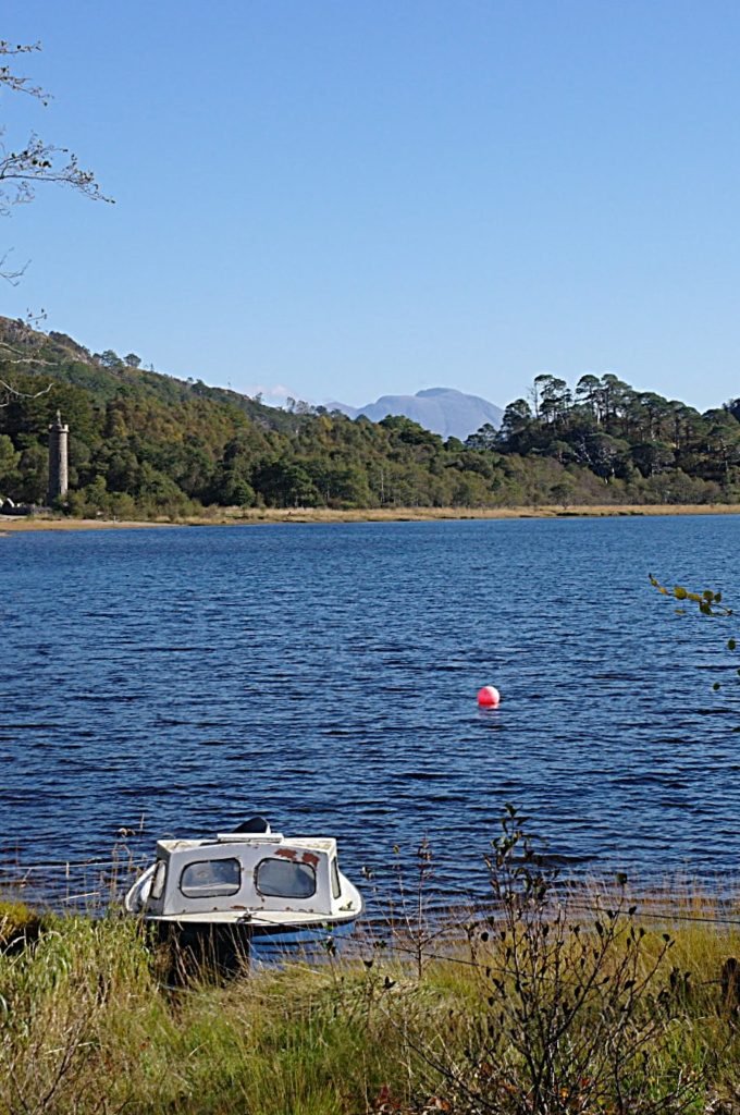 View from grounds of Glenfinnan Hotel. Glenfinnan Monument, left, and Ben Nevis on horizon, centre View from grounds of Glenfinnan Hotel. Glenfinnan Monument, left, and Ben Nevis on horizon, centre