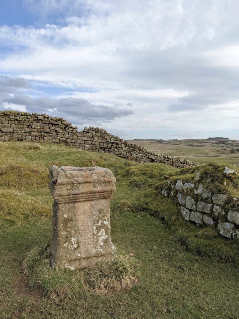 An altar at Aesica Roman Fort, in a field, easily overlooked while Walking Hadrian's Wall