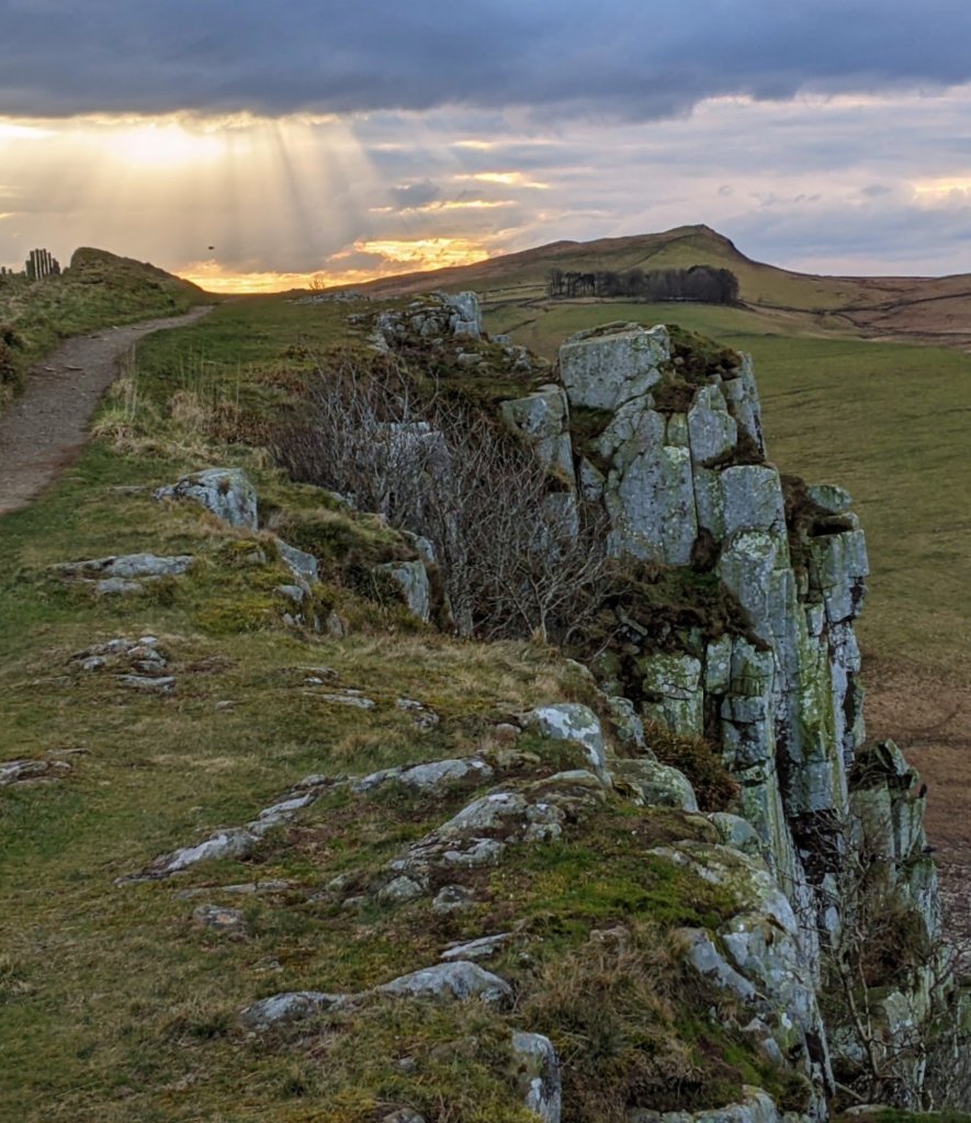 In just a few places, while walking Hadrian's Wall, the footpath runs very close to some impressive drops over the scarp face of the Whinstone Sill, as here near the Crag Lough (Loch).